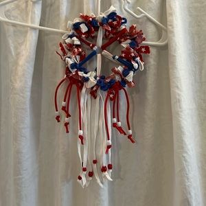 Dream catcher made from nylon loops, cotton strips on metal hoop